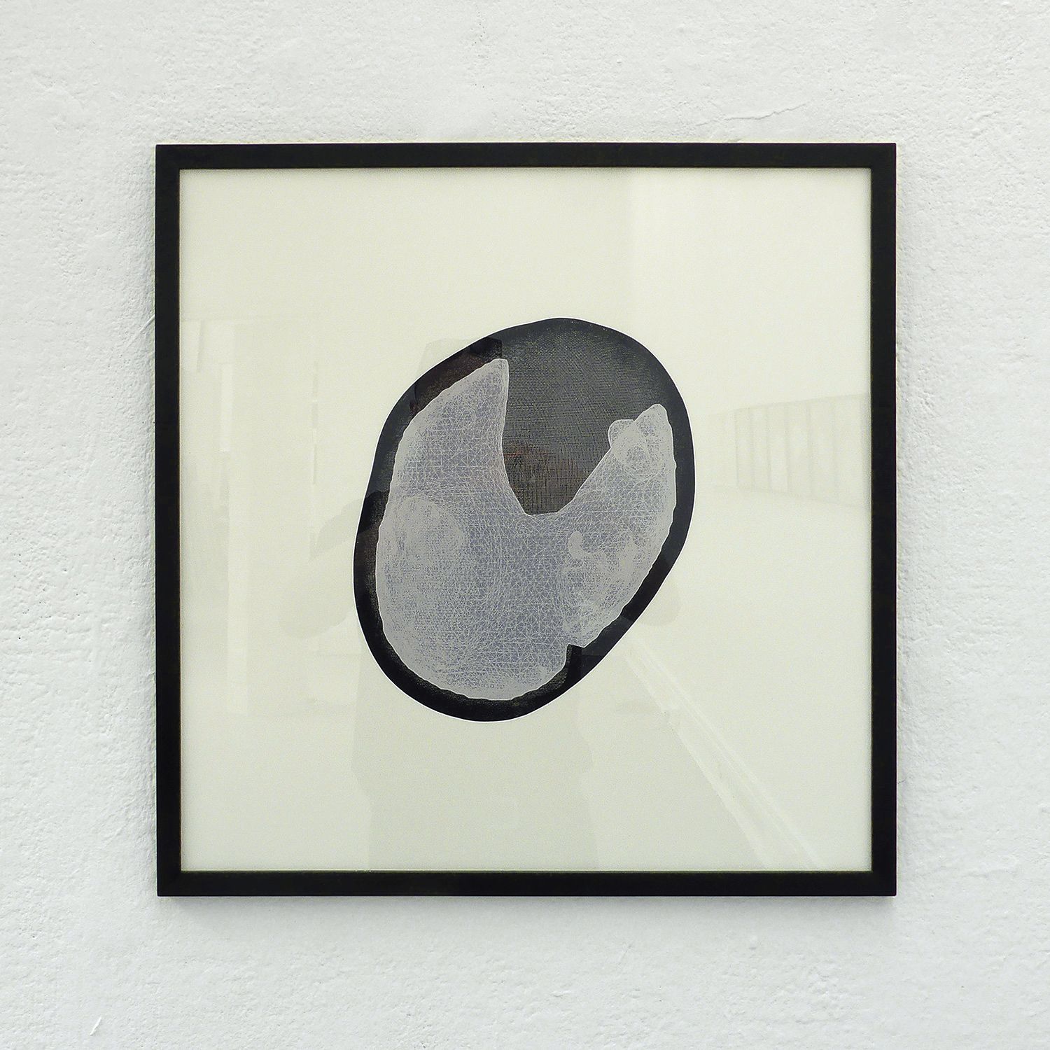 Lacuna screen print with black frame installed on a white wall.